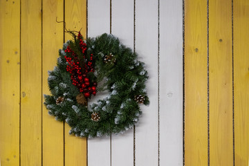 christmas wreath on wooden door