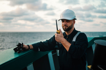 Marine Deck Officer or Chief mate on deck of offshore vessel or ship , wearing PPE personal...