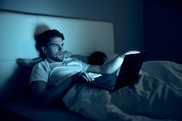 Fototapeta premium man sitting on sofa and watching tv