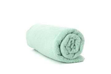 Rolled green towel isolated on white background, close up
