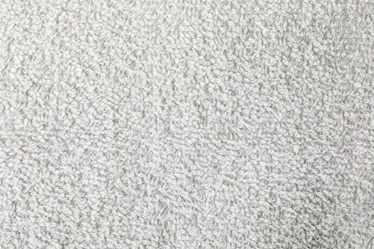 Grey towel textured background, closeup and space for text