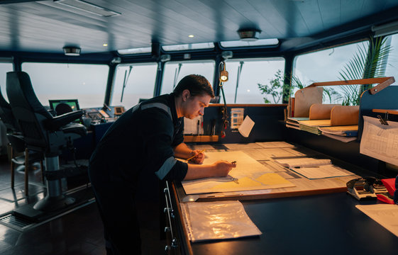 Marine navigational officer during navigational watch on Bridge . He does chart correction of nautical maps and publications. Work at sea