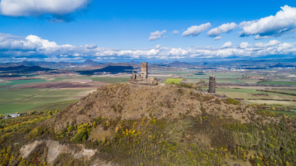 Castle Hazmburk. Ruines of Hazmburk castle on top of mountain peak of Ceske Stredohori range. ...
