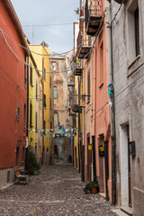 Fototapeta na wymiar Narrow street in Bosa, Sardinia, Italy
