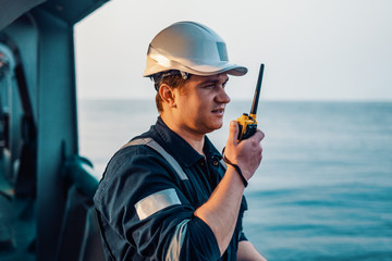 Marine Deck Officer or Chief mate on deck of offshore vessel or ship , wearing PPE personal...