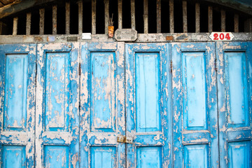 Old wooden door, blue, black ground texture