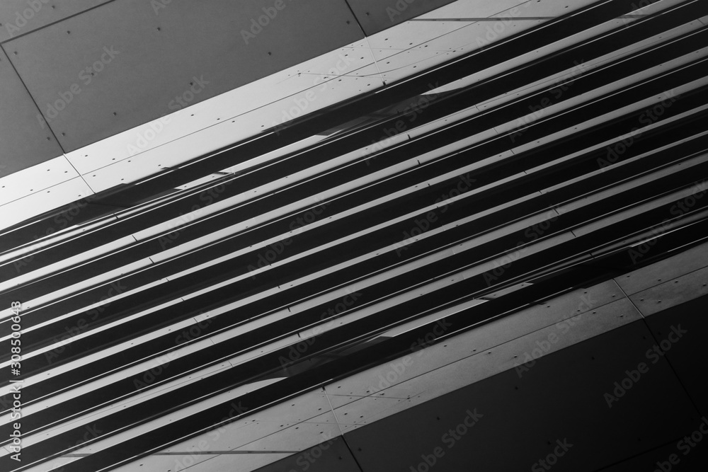 Poster low angle view of gray steel wall panels with slots. fragment of industrial building exterior. abstr