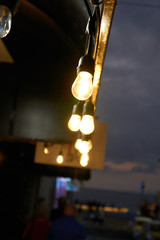 Vintage spotlights decorating a bar on a rustic street