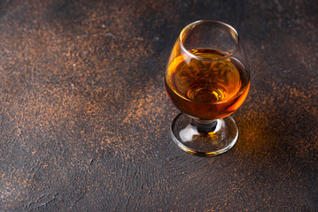 Glass of cognac or whiskey.
