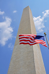Washington Monument and national flag of USA at the center of Washington, District of Columbia DC, USA.