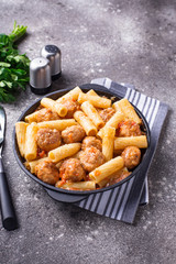 Pasta with meatballs in tomato sauce.