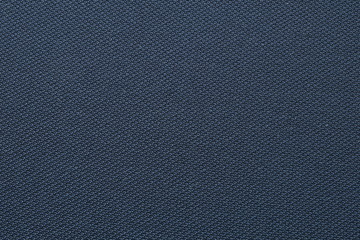 Fototapeta na wymiar Close up shot of midnight dark blue formal suit cloth textile surface. wool fabric texture for important luxury evening or night event. Wallpaper and background with copy space for text