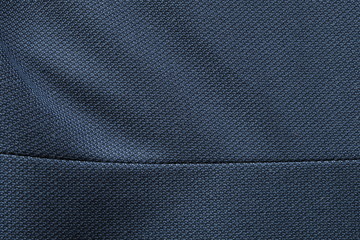 Close up shot of midnight dark blue formal suit cloth textile surface. wool fabric texture for important luxury evening or night event. Wallpaper and background with copy space for text