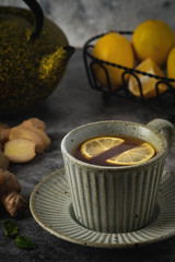cup of tea with lemon, ginger, winter drink
