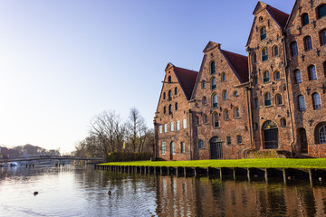 Old salt kontor at trave river on a sunny winter day in Lübeck, Germany