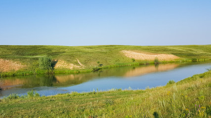 Obraz premium travel, tourism, camping Tent on the river Bank. Tent and a campfire on the banks of rivers, lakes.