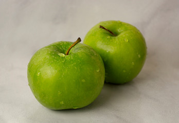 green apples on black background