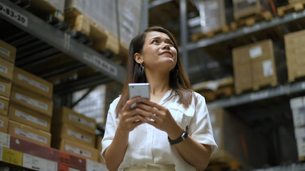 Shopping concepts. Asian woman is walking to shop in the warehouse. 4k Resolution.