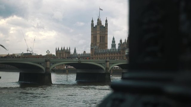 Cinematic reveal of Westminster Palace Victoria Tower British Parliament and River Thames