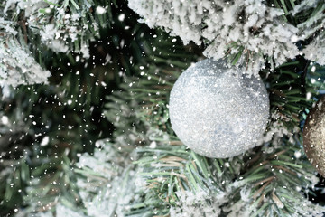 Decorated Christmas ball on tree New Year holidays background