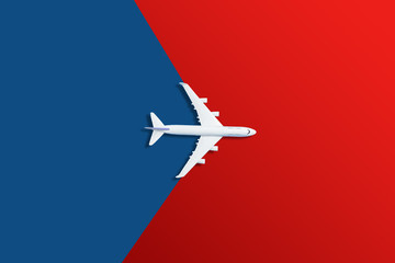 Airplane model. White plane on red background.