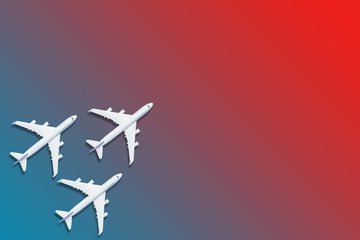 Fototapeta premium Airplane model. White plane on red background.