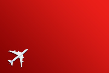 Fototapeta premium Airplane model. White plane on red background.