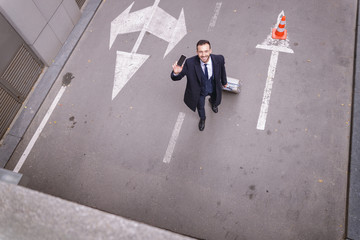 Top view photo of kind man that standing on parking