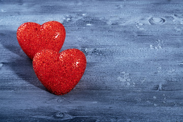red heart on blue wooden background..