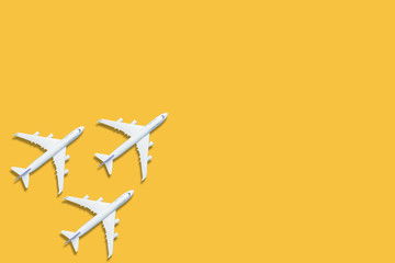 Leadership concept with plane leading among white on yellow background