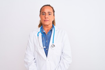 Middle age mature doctor woman wearing stethoscope over isolated background Relaxed with serious expression on face. Simple and natural looking at the camera.