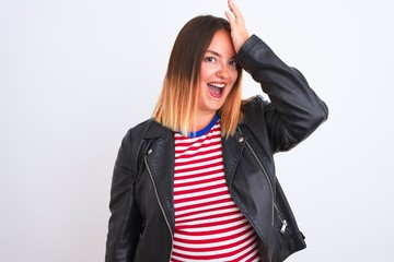 Young beautiful woman wearing striped shirt and jacket over isolated white background surprised with hand on head for mistake, remember error. Forgot, bad memory concept.
