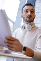 Handsome student trying to memorize new topic