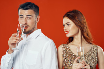 man and woman with glass of red wine