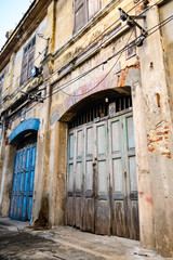 Fototapeta na wymiar street in old town old wooden door with lock blue color