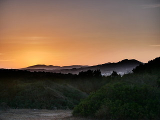 Impressively artistic orange glow of the mountain view in Cala Millor, Majorca