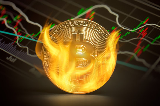 Golden bitcoin burning in flames