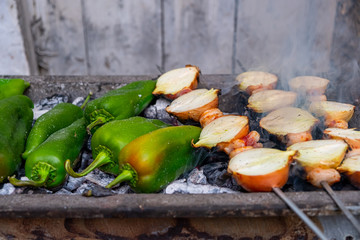 Grilled green pepper and onion on barbecue. Vegetarian bbq