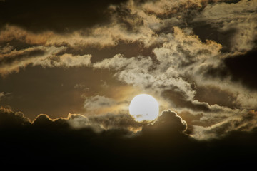 Naklejka na ściany i meble sunset in the dramatic clouds