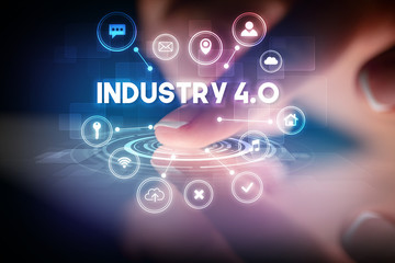 Finger touching tablet with web technology icons and INDUSTRY 4.0 inscription, web technology concept
