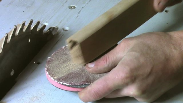 In carpentry stodio workplace. Wood processing woodworking close-up. Process of creating  handmade wooden product.