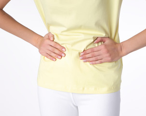 Young beautiful woman having painful stomachache on white background.Chronic gastritis. Abdomen bloating concept