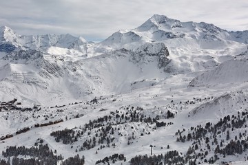 Winter snowy landscape with trees, ski slopes of Paradiski France