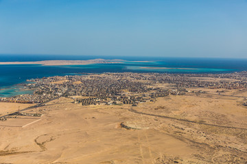 City of Hurghada, Egypt (Al-Bahr al-ahmar) located on red sea coast under control of red sea government  a famous tourist destination - aerial view 