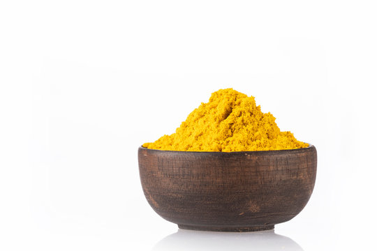 Curry powder in a bowl - White background