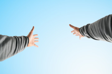 Hands raised to the sky. Point of view