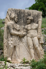 Obraz premium Greek tablet and handshake relief of Hercules and Antiochus at Arsemia region