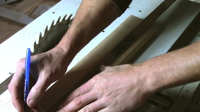 In carpentry stodio workplace. Wood processing woodworking close-up. Process of creating  handmade wooden product.