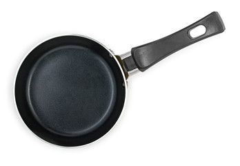 Small black frying pan with nonstick surface isolated on white background, close-up, top view.