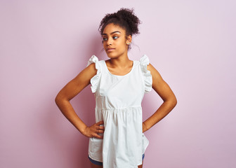 Fototapeta premium Young beautiful african american teenager girl standing wearing elegant white t-shirt